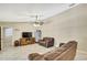 Bright living room with tile floors and a ceiling fan at 4706 Scott Rd, Lutz, FL 33558
