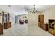 Spacious open-plan living room with tiled floors and neutral wall colors at 4706 Scott Rd, Lutz, FL 33558