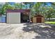 View of a versatile outbuilding offering ample space for a variety of uses or storage on the property at 4706 Scott Rd, Lutz, FL 33558
