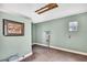 Small unfinished room features a picture frame, electrical box, concrete flooring, and a window at 4706 Scott Rd, Lutz, FL 33558