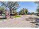 Elegant gated community entrance with brick pillars, mature trees, and landscaped grounds at 5049 Rushbrook Rd, Land O Lakes, FL 34638