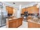 Spacious kitchen features granite countertops and stainless steel appliances at 5049 Rushbrook Rd, Land O Lakes, FL 34638