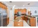Spacious kitchen features granite countertops, stainless steel appliances, and tile floors at 5049 Rushbrook Rd, Land O Lakes, FL 34638