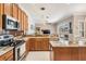 Spacious kitchen features granite countertops and stainless steel appliances at 5049 Rushbrook Rd, Land O Lakes, FL 34638