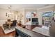 Open-concept living space with a dining area and a glimpse of the pool area at 5049 Rushbrook Rd, Land O Lakes, FL 34638