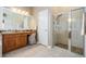 Comfortable primary bathroom features a vanity, walk-in shower, and soaking tub at 5049 Rushbrook Rd, Land O Lakes, FL 34638