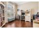 Cozy office space with hardwood floors, built-in bookshelves, and natural light at 5049 Rushbrook Rd, Land O Lakes, FL 34638