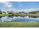 Scenic water view with lush greenery and reflections of homes, creating a peaceful atmosphere at 5049 Rushbrook Rd, Land O Lakes, FL 34638
