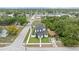 An aerial perspective showcases the home's layout, surrounded by lush trees and neighboring buildings at 5055 2Nd S Ave, St Petersburg, FL 33707