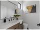 Modern bathroom with sleek vanity, contemporary fixtures, and stylish mirror creating a spa-like atmosphere at 5055 2Nd S Ave, St Petersburg, FL 33707