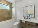 Modern bathroom featuring wood-look tile in shower and sleek vanity with rectangular sink at 5055 2Nd S Ave, St Petersburg, FL 33707