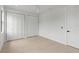 Bright bedroom with hardwood floors, white walls and ample storage with double closets at 5055 2Nd S Ave, St Petersburg, FL 33707