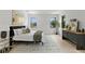 Large bedroom features black trim windows, a modern rug, and contemporary décor at 5055 2Nd S Ave, St Petersburg, FL 33707