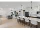 Open concept living room and kitchen featuring island seating and modern fixtures and finishings at 5055 2Nd S Ave, St Petersburg, FL 33707