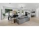 Spacious living area with modern furnishings, open kitchen, and ample natural light creating an inviting space at 5055 2Nd S Ave, St Petersburg, FL 33707