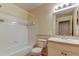 Full bathroom featuring a shower-tub combo, single vanity, and white fixtures at 5915 Brickleberry Ln # 103, Zephyrhills, FL 33541