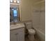 Cozy bathroom featuring a tub, toilet, and vanity with a sink and mirror at 5915 Brickleberry Ln # 103, Zephyrhills, FL 33541