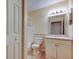 Bathroom featuring a vanity with storage, a toilet, and a shower/tub combo at 5915 Brickleberry Ln # 103, Zephyrhills, FL 33541