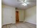 Bedroom featuring light walls, a ceiling fan, and light wood flooring at 5915 Brickleberry Ln # 103, Zephyrhills, FL 33541