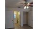 Spacious bedroom with ceiling fan, walk-in closet, and en-suite bathroom at 5915 Brickleberry Ln # 103, Zephyrhills, FL 33541