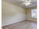 Bedroom with ceiling fan, window, and light-colored flooring at 5915 Brickleberry Ln # 103, Zephyrhills, FL 33541