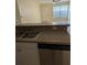 Functional kitchen design featuring stainless steel dishwasher and laminate countertops at 5915 Brickleberry Ln # 103, Zephyrhills, FL 33541