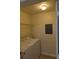 Convenient laundry room with a washing machine, dryer, and utility shelves at 5915 Brickleberry Ln # 103, Zephyrhills, FL 33541