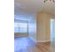 Bright interior featuring a large window, wood-look flooring, and neutral walls at 5915 Brickleberry Ln # 103, Zephyrhills, FL 33541