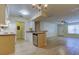 Bright living space with an open floor plan that connects kitchen, dining, and living areas at 5915 Brickleberry Ln # 103, Zephyrhills, FL 33541