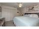 Bedroom features a large closet and a queen bed with light blue bedding and modern decor at 6129 Schalekamp Dr, Spring Hill, FL 34609