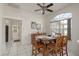 Bright dining room with a large window and an elegant table with six chairs at 6129 Schalekamp Dr, Spring Hill, FL 34609