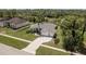 Beautiful home with a well-manicured lawn, mature landscaping, and a spacious driveway at 6129 Schalekamp Dr, Spring Hill, FL 34609