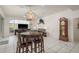 Spacious living room with tile flooring, an elegant chandelier, and view of living area at 6129 Schalekamp Dr, Spring Hill, FL 34609