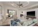 Bright living room with tile floors, recessed lighting, and sliding glass doors to the pool at 6129 Schalekamp Dr, Spring Hill, FL 34609