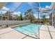 Inviting screened-in pool with clear blue water and ample deck space for lounging at 6129 Schalekamp Dr, Spring Hill, FL 34609