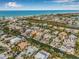 An aerial view highlighting the property's location on a canal with nearby beach access, showcasing the waterfront lifestyle at 614 Norton St, Longboat Key, FL 34228