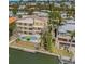 Stunning aerial view of waterfront property with private pool, lush landscaping and beautiful dock at 614 Norton St, Longboat Key, FL 34228