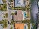 Aerial view of a large home with a pool, canal access, and a well-manicured yard at 614 Norton St, Longboat Key, FL 34228
