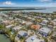 Overhead view of the waterfront neighborhood with canals, boating access, and beach, illustrating a coastal lifestyle at 614 Norton St, Longboat Key, FL 34228