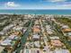 Panoramic aerial view of a home situated in a canal-rich community, offering direct access to the open water and beach at 614 Norton St, Longboat Key, FL 34228