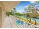 Relaxing balcony view overlooking the private pool and tranquil canal at 614 Norton St, Longboat Key, FL 34228