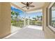 Outdoor balcony with white railing overlooking lush greenery and serene water views at 614 Norton St, Longboat Key, FL 34228