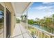 Balcony offering scenic views of the canal and surrounding tropical landscape, providing a tranquil retreat at 614 Norton St, Longboat Key, FL 34228