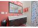 Bathroom featuring a double vanity, a large mirror, and a separate shower area at 614 Norton St, Longboat Key, FL 34228