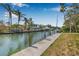 Picturesque waterfront view from a private dock with boats, homes, and clear blue skies, offering direct water access at 614 Norton St, Longboat Key, FL 34228