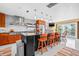 Bright, updated kitchen with a large island, stainless steel appliances, and access to a balcony at 614 Norton St, Longboat Key, FL 34228