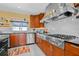 Well-equipped kitchen featuring stainless steel appliances and custom cabinetry at 614 Norton St, Longboat Key, FL 34228