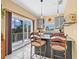 Stylish kitchen with island seating, pendant lighting, and views of a private balcony at 614 Norton St, Longboat Key, FL 34228