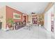 Spacious living room with tile flooring, a sliding glass door, and a leather sofa at 614 Norton St, Longboat Key, FL 34228