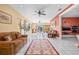 Large living room with white tile floors, ceiling fans, and sliding glass doors leading to the balcony at 614 Norton St, Longboat Key, FL 34228